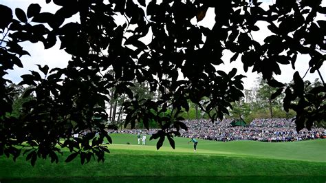 Masters Champion Tiger Woods Lines Up A Putt On The No Green During