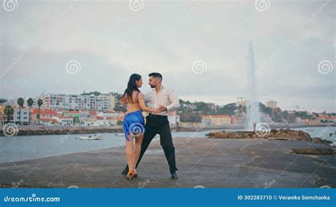 Passionate Pair Performing Latin American Dance On Embanking Couple