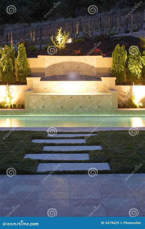 A Pool with a Waterfall in a Luxury Backyard Stock Image - Image of ...