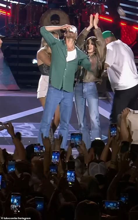 Glen Powell Chugs A Beer On Stage At Luke Combs Concert With Twisters