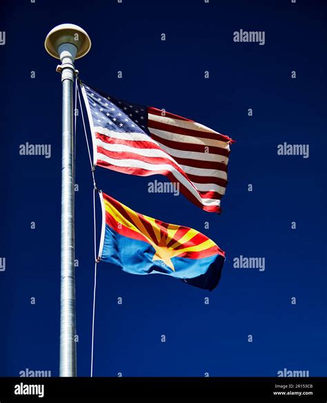 American Flag With The Arizona State Flag On A Flag Pole Stock Photo