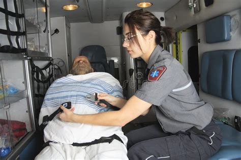 Paramedics Giving First Aid To Injured Person Stock Image Image Of