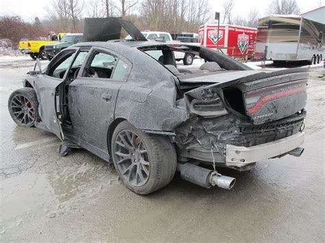 Wrecked Dodge Charger Hellcat Shows Up For Sale Is Full Of Bullet