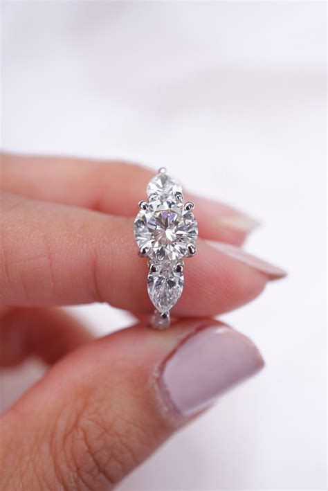 Round Diamond Ring With Pear Shape Diamond Side Stones Diamond