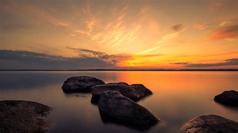 Summer Dusk Rocks Between Lake During Sunset Time 4k 5k Hd Nature Wallpapers Hd Wallpapers