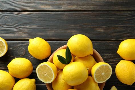 Premium Photo Ripe Lemons On Wooden Top View