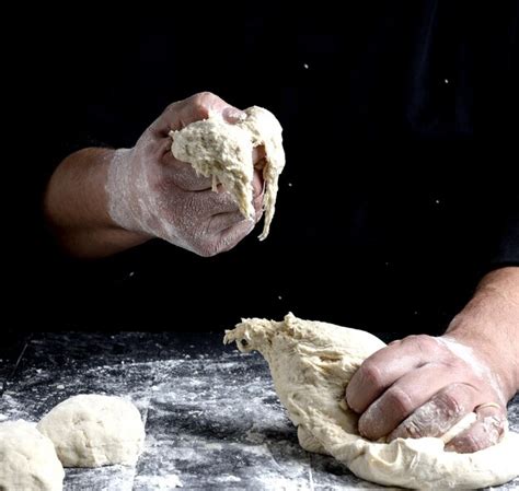 Premium Photo Midsection Of Men Kneading Dough On Table