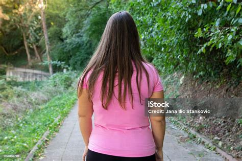 Beautiful Plus Size Woman Walking In Public Park Her Back And Hair Are On Focus On Beautiful