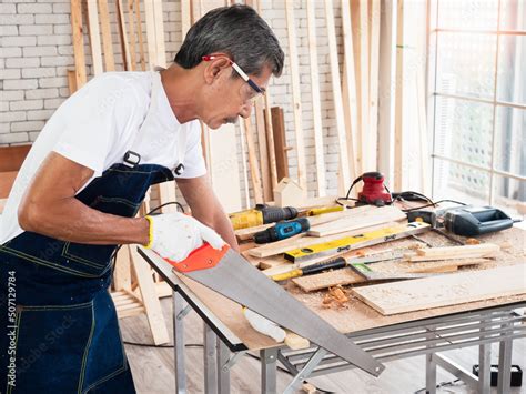 older carpenter working  woodcraft   hand