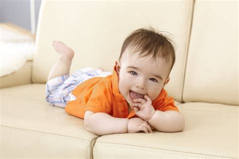 Beautiful Baby Boy Lying On Sofa Stock Photo Image Of Couch Hand