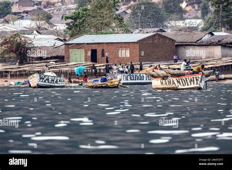 Fishermen, Dusk, fish drying platforms, Chembe fishing village ...