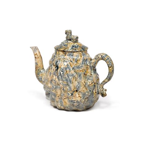 A Staffordshire Sold Agate Pecten Shell Teapot And Cover Circa 1750