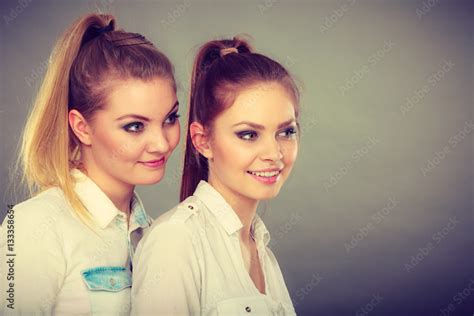 Two Beautiful Women Blonde And Brunette Having Fun Stock Photo Adobe Stock