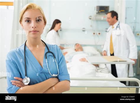 Blonde Nurse Next To Medical Bed Stock Photo Alamy