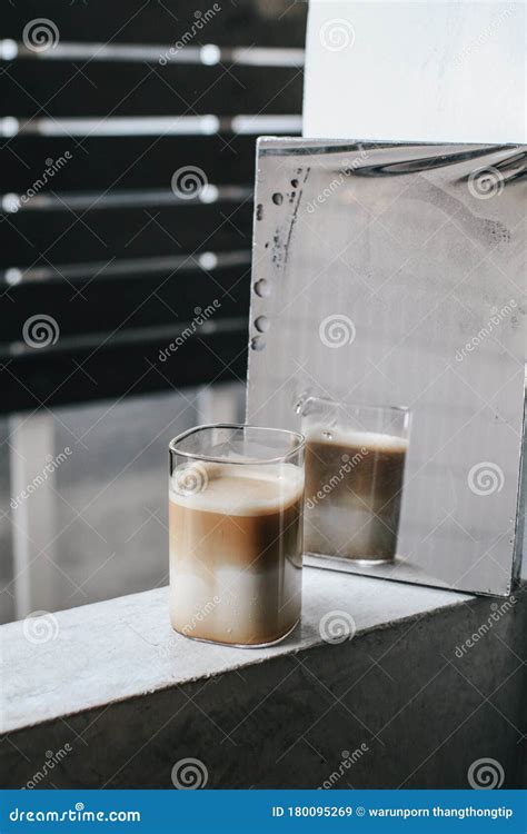 Cup Of Coffee A With Shadows Reflected In The Mirror On Loft Background