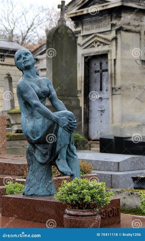 Old Weathered Statue Standing Near Graves Of Historic Pere Lachaise Cemeteryparisfrance2016