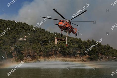 SIKORSKY S-64 SKYCRANE FIREFIGHTING PLANE APPROACHES Editorial Stock ...