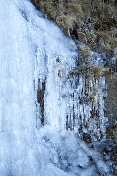 Frozen waterfall. Ice river. Sani Pass - mountain pass between the ...