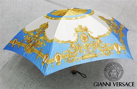 ジャンニヴェルサーチ Gianni Versace エレガントなバロック柄 サンバースト太陽神 折りたたみ傘雨傘 収納カバー付き 男女兼用