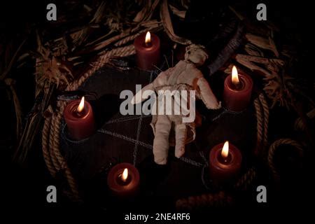 Occultist Dripping Hot Wax On Voodoo Doll Magic Rituals Black Spell