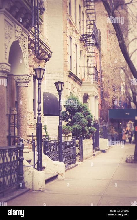 Pretty New York City street scene with apartment buildings and vintage ...