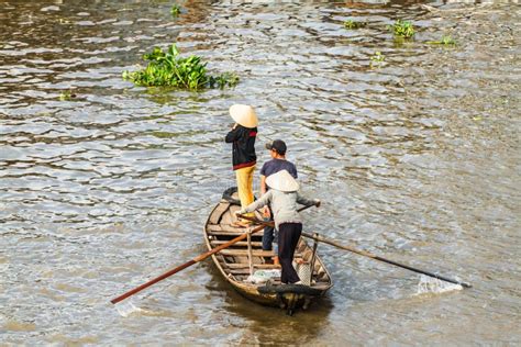 Small Boat Transporting People Go And Back To The Floating Market In