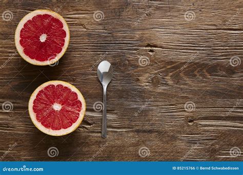 Halved Organic Grapefruit And Spoon Ready To Eat Stock Photo Image Of