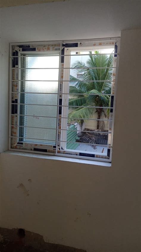 Mm Upvc Sliding Windows With Mesh With Grills At Rs Sq Ft In