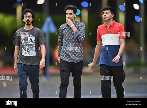 Men in the streets of Doha, Qatar Stock Photo - Alamy