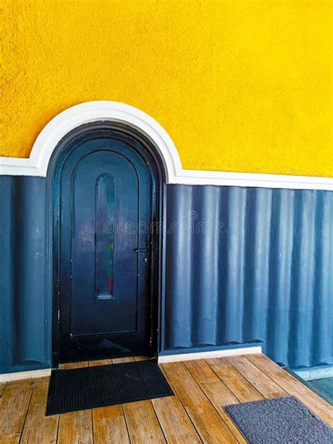 Modern Style Dark Blue Arch Door with Yellow Color Wall. Dark Blue ...