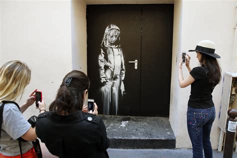 Banksy is back with 9 new fiery murals in Paris | Mashable