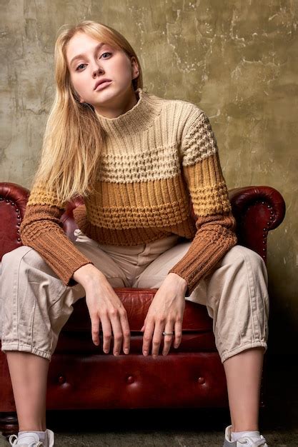 Premium Photo Beautiful Serious Bossy Blonde Female On Leather Couch