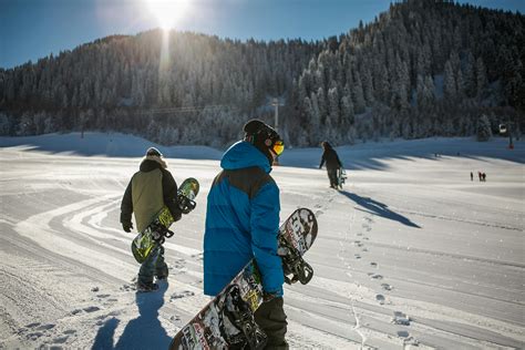 Man In Black Snowboard With Binding Performs A Jump · Free Stock Photo