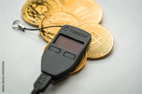 Trezor Hardware wallet for safely store your cryptocurrency. Stock Photo | Adobe Stock