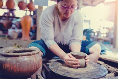 Woman Moulding Clay On Pottery Wheel Stock Photo Image Of Maker