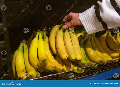 Hand Taking Bananas From Grocery Store Shelf Stock Image Image Of Mankind Groceries 294065059