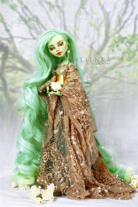 A Doll With Green Hair And Gold Dress