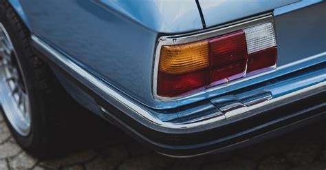 Detail Shot of a Classic Car's Rear Bumper · Free Stock Photo