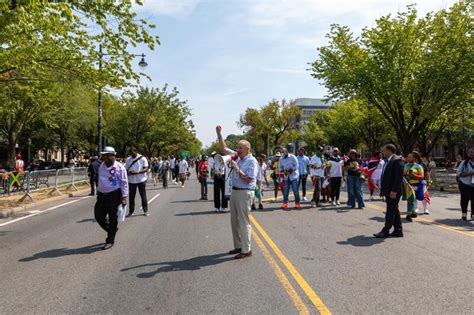 People Walking With Chuck Schumer At The West Indian Labor Day Parade