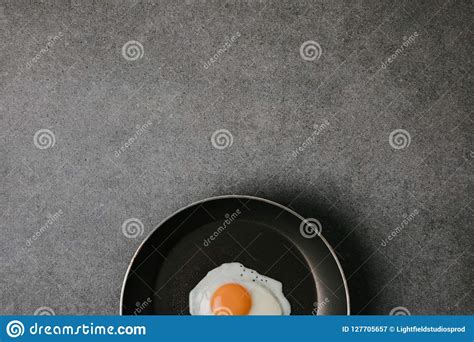 Top View Of Frying Pan With Tasty Fried Egg On Grey Background Stock Image Image Of Closeup