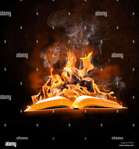 Image Of Opened Burning Book Against Black Background Stock Photo Alamy