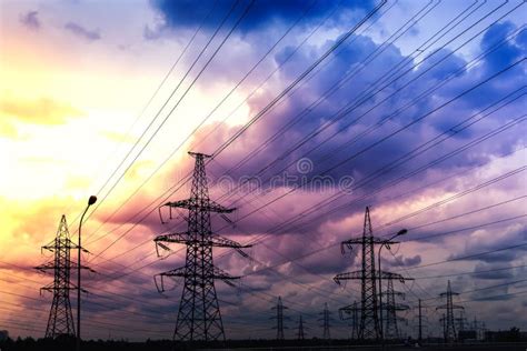 Silhouette Of High Voltage Electrical Towers On A Sunset Background