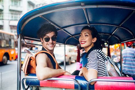 Couple Riding In A Tuk Tuk Taxi In Bangkok By Stocksy Contributor