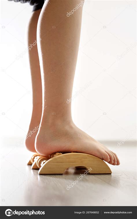 Baby S Foot Feet Of Baby S Naked Against The Background Of The Wooden