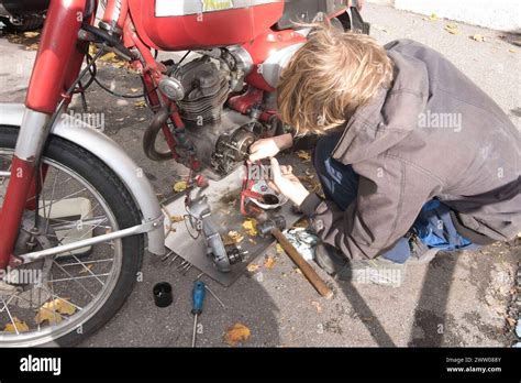 A Motorcycle Mechanic Is Repairing A Motorcycle Bike Repair Workshop