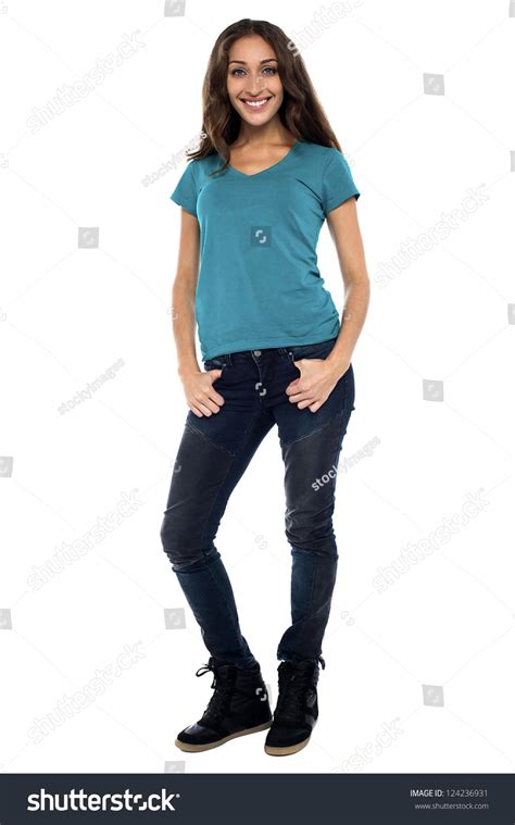 Full Body Young Woman In Casual Clothes Relaxed Pose Isolated Over A