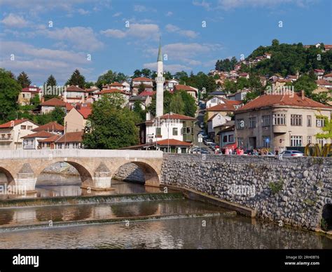 Bridge Over The Miljacka River With Inat Kuca Restaurant Centre In The