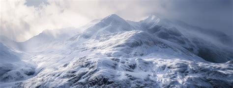 Premium Photo Majestic SnowCovered Mountains Under Cloudy Skies