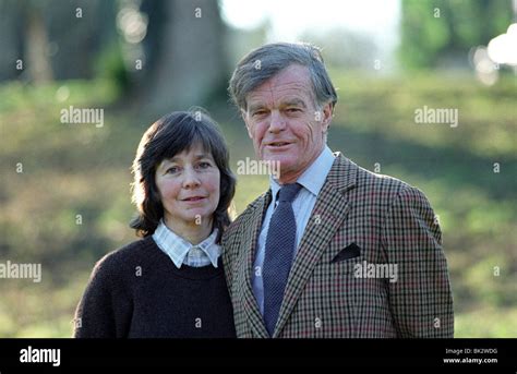 Alan Clark, diarist and historian with his wife Jane in the grounds of Saltwood Castle, their ...