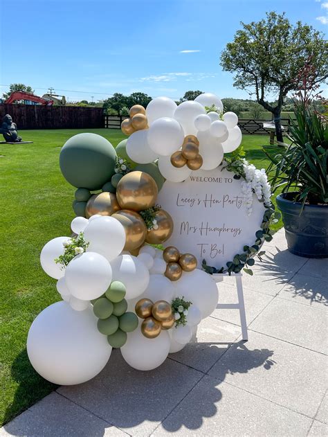 Eucalyptus And White Welcome Sign With Organic Balloon Garland